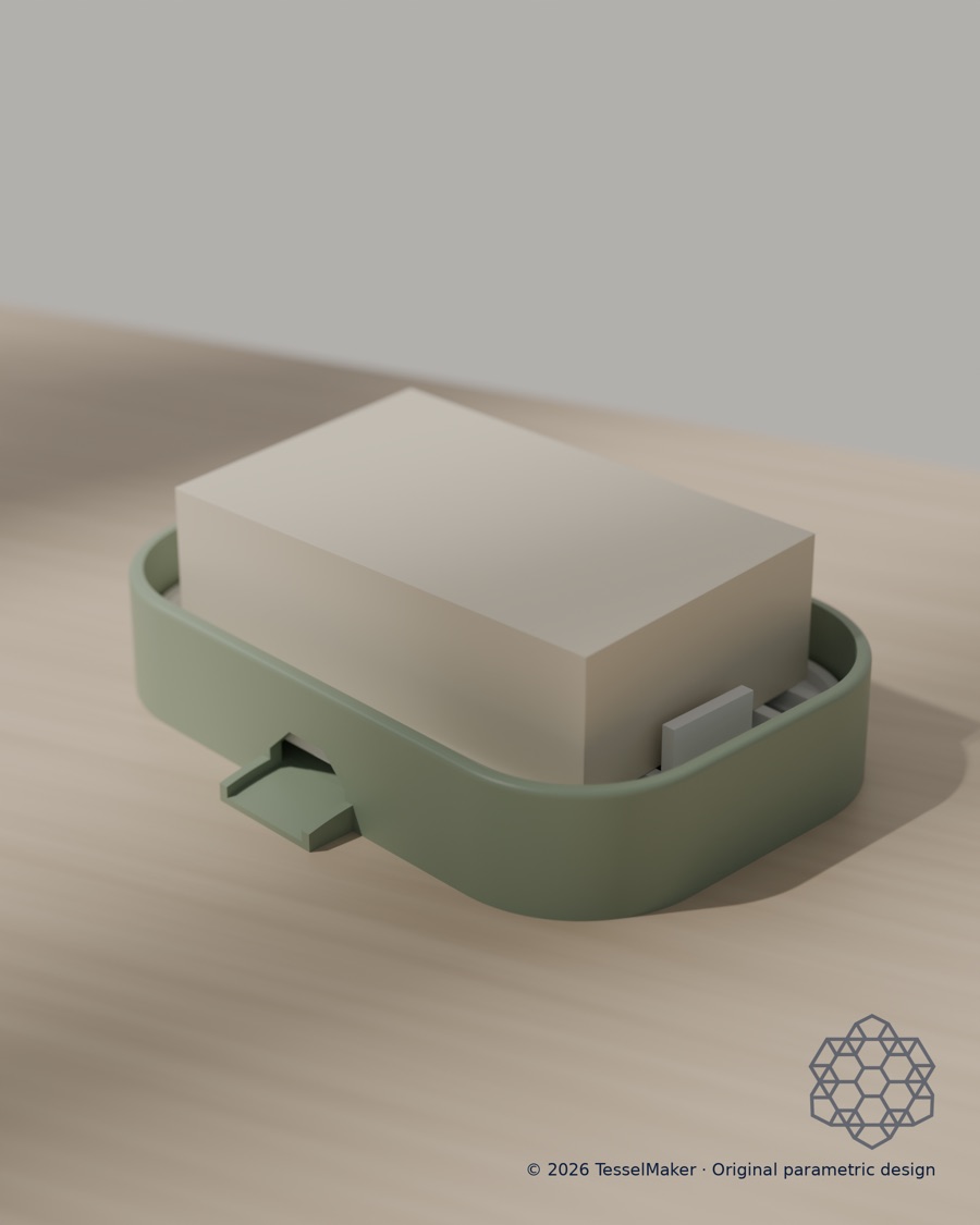 Two-piece sage soap dish with a bar of soap on its slotted tray.